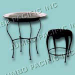 Wrought iron table with glass and chair combination.